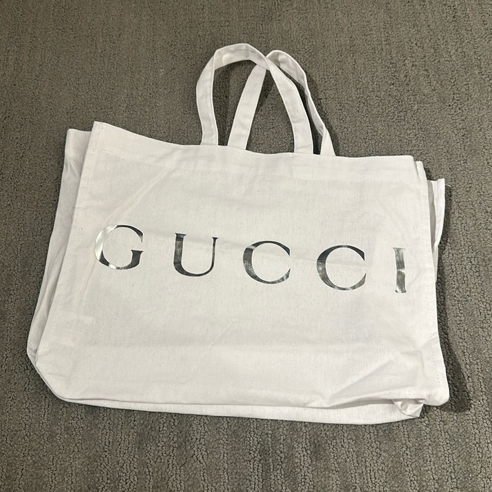 Gucci white dust bag
Silver GUCCI logo